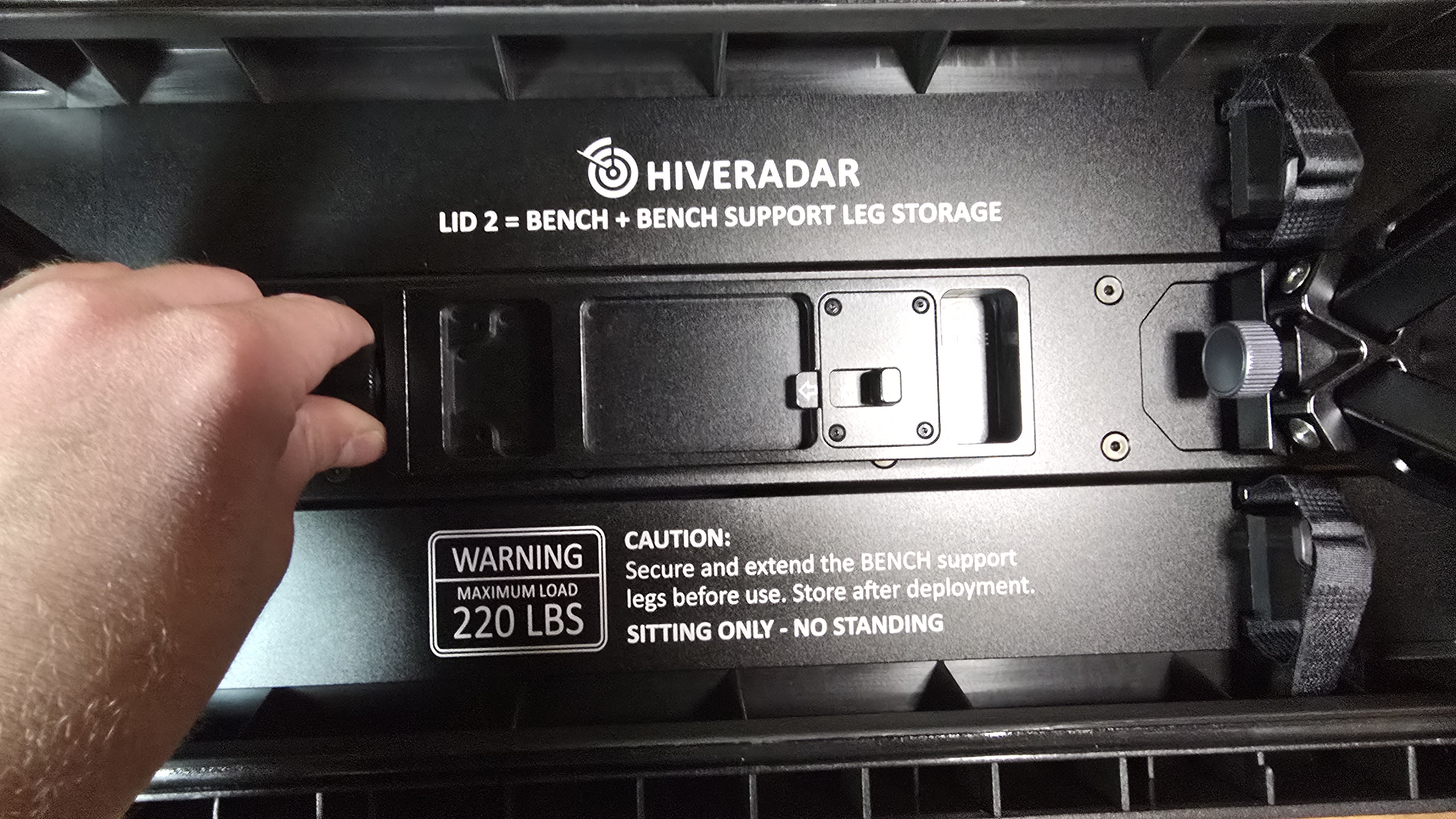 Work Surface Arm storage location on underside of bench lid